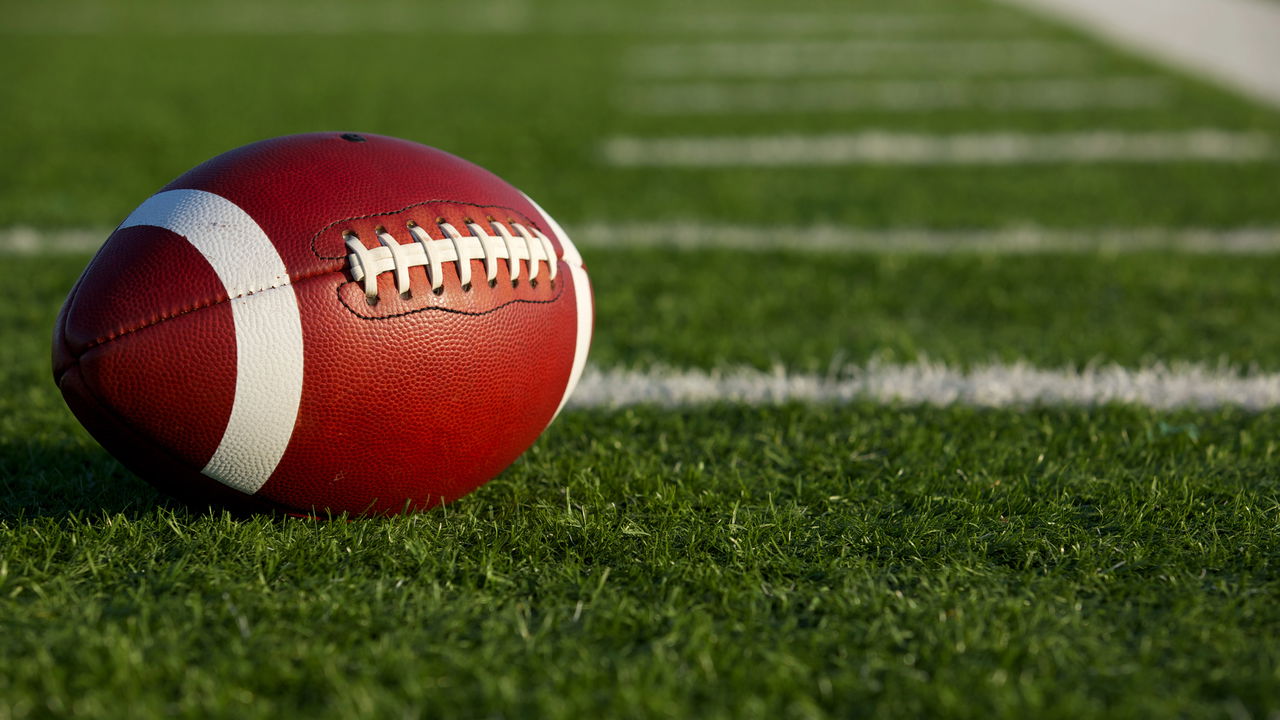 Jogador celebrando um touchdown em uma partida da NFL
